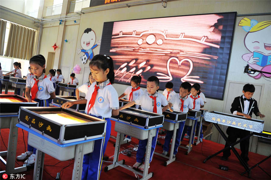 Qingdao students show talents at sand art festival