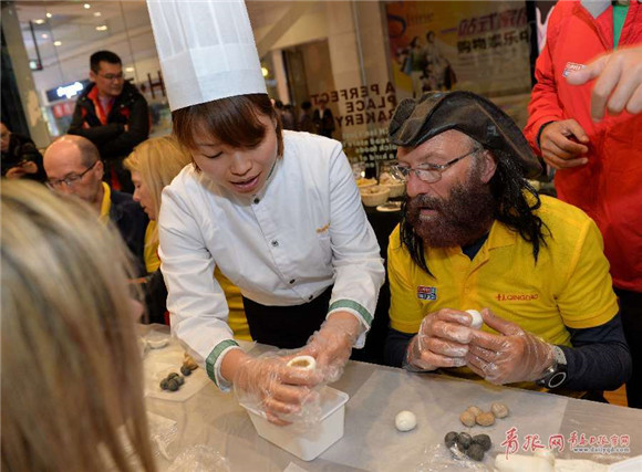 Clipper Race Qingdao crew members make glutinous rice balls